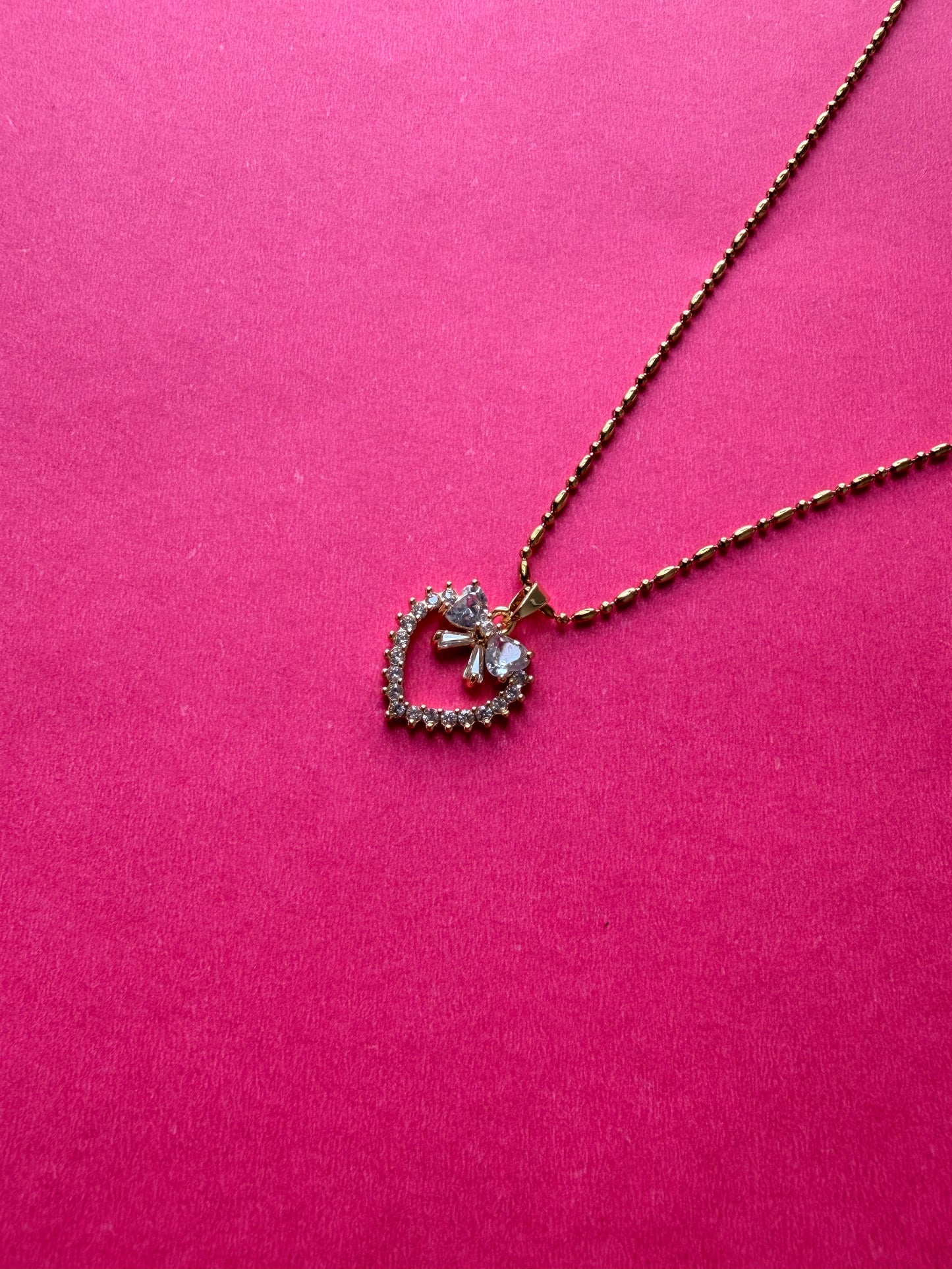 Bow-Accented Radiant Heart pendent