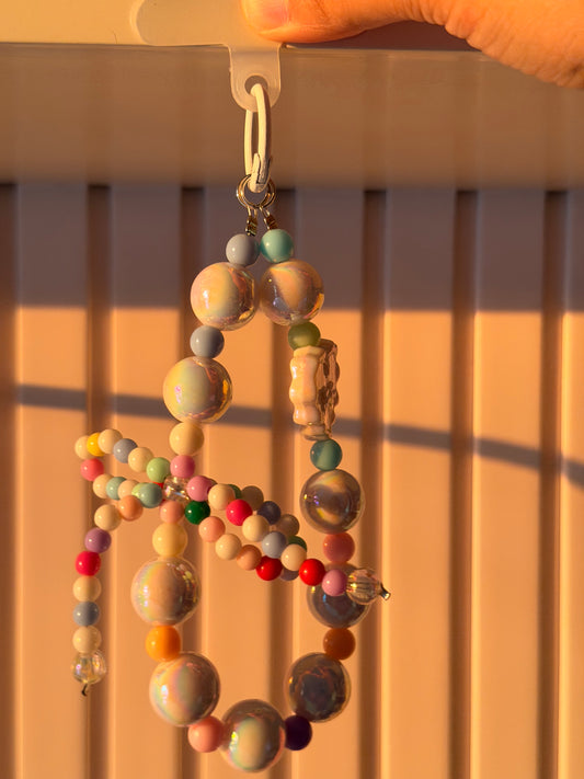 Multi colour bow bag/phone charm
